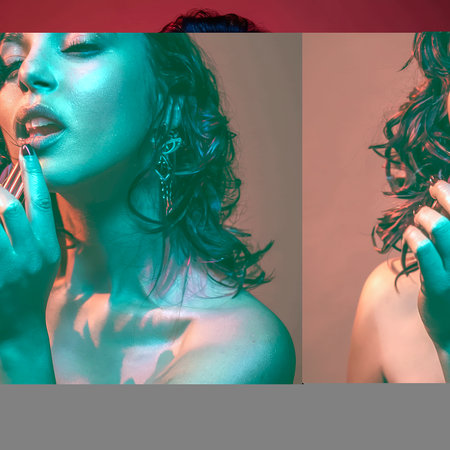 red lighting on sexy woman touching lips isolated on blackの素材