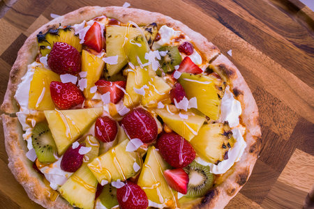 Grilled fruit pizza with cream cheese, honey and coconut best summer dessertの素材
