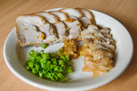 sliced baked ham on a plateの写真素材
