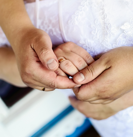 hands with wedding ringsの写真素材