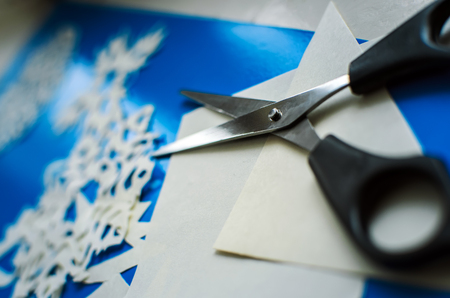 Christmas snowflakes cut from paperの写真素材