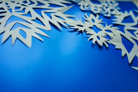 Christmas snowflakes cut from paperの写真素材
