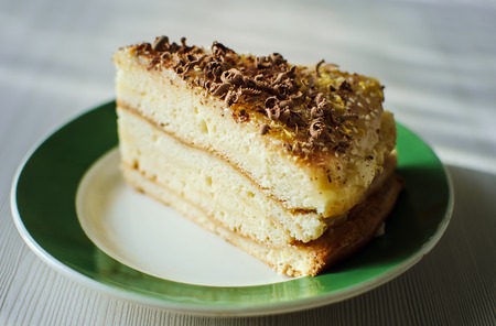 a piece of homemade biscuit cakewith chocolate sprinkles closeupの写真素材