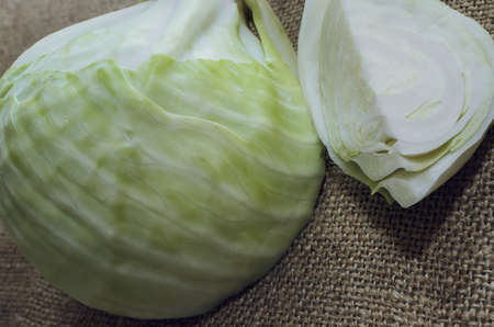 cabbage and cutted cabbage on sackclothの写真素材
