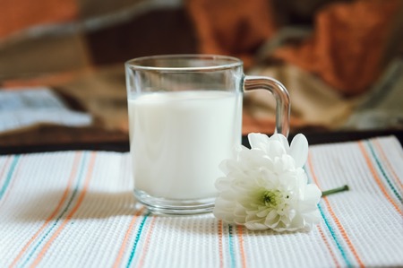 milk and white flower on a tray, healthy breakfastの写真素材