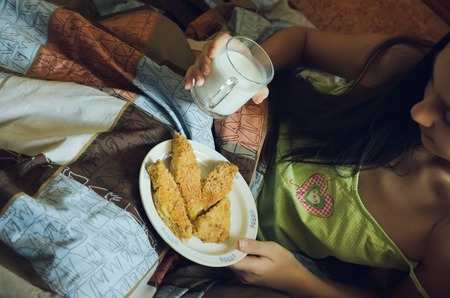Healthy breakfast in bed - cookies and milk.の写真素材