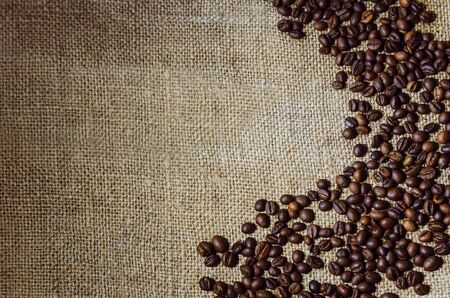 Coffee beans lie on the table, top view. Close-up.の写真素材