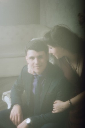 Attractive guy with a girl hugging in the room. Soft focusの写真素材