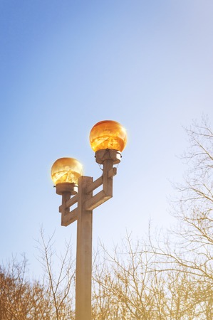 Lantern with yellow plafond on the sky background.の写真素材