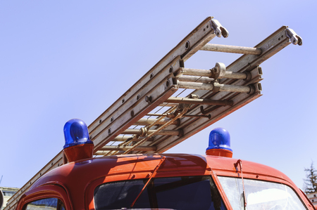 Fire escape on the fire red car close-up.の写真素材