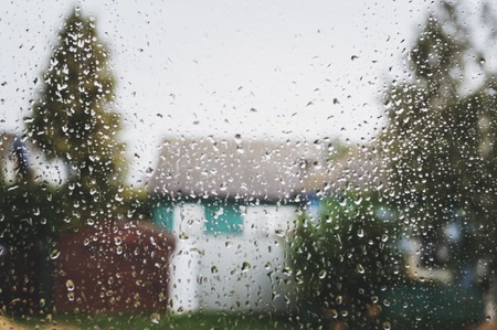 View from the window to the street in rainy weather. Sad autumn weather.の写真素材