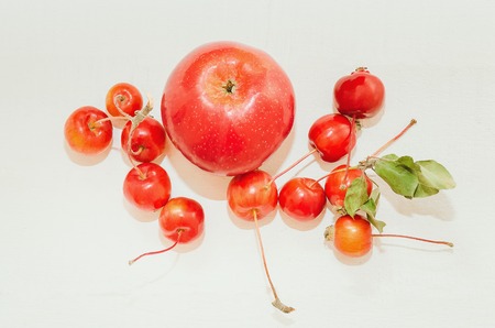 Red ripe apples Malus 'Ranetka' on white background.の写真素材
