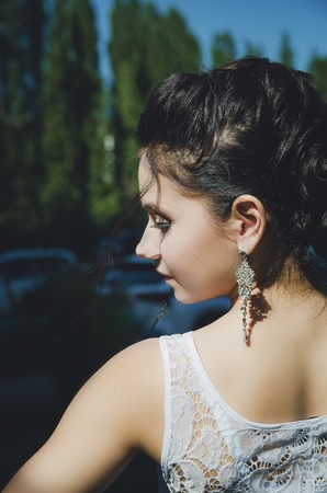 Portrait of a beautiful brunette girl with black eyes.の写真素材