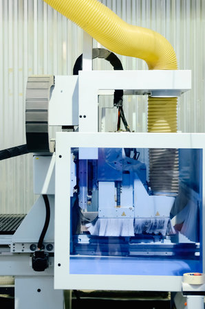 Furniture manufacturing - a machine for processing raw materials.