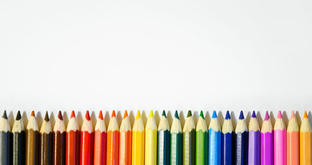 Colored pencils on white background. Close-up, copy-space for text.