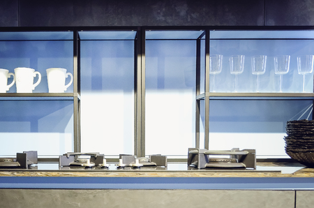 Kitchen modern cupboard with glass doors and lighting. Modern kitchen interiorの写真素材