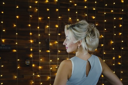 Beautiful woman 40 years old with blond hair, profile.の写真素材