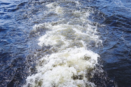 Wave from a boat on the water. Texture of water.の写真素材