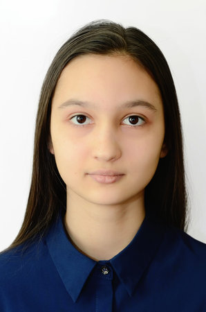 Photo of a teenage girl face on a white background on documents.
