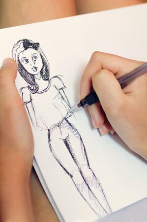 Girl draws, close-up. Vertical photography.の写真素材