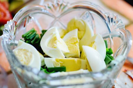 Salad with boiled egg and greens.の写真素材