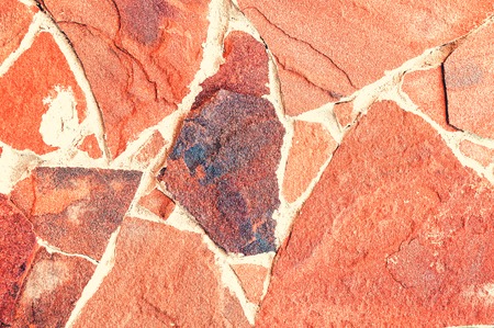 Decorative stone background, texture of a stone for decorating of facades of buildings and internal walls.の写真素材