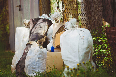 Waste boxes and garbage bags. Garbage collection in a holiday village.の写真素材