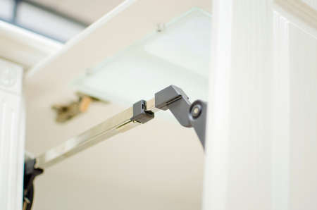 Lifting mechanism of the kitchen facade. Close-up.の写真素材