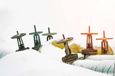 There are many valves on the heating pipe.の写真素材