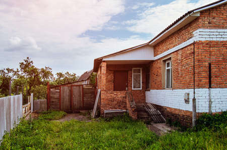 Old red brick village house. Village in Russia.の写真素材