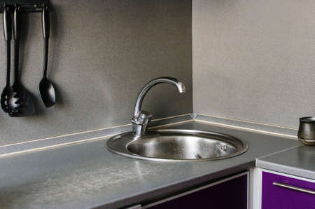 Fragment of home cooking. Mixer and sink in the kitchen.の写真素材