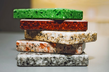 close up swatch of artificial stone samples showing various texture and color for example terrazzo, quartz, grainy stone textures. samples of artificial stone. finishing material, interior renovation.の写真素材