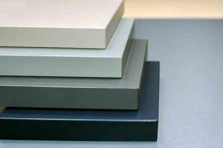 A stack of samples of furniture facades.