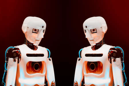 Future technologies concept. Modern robots on a red background.の写真素材