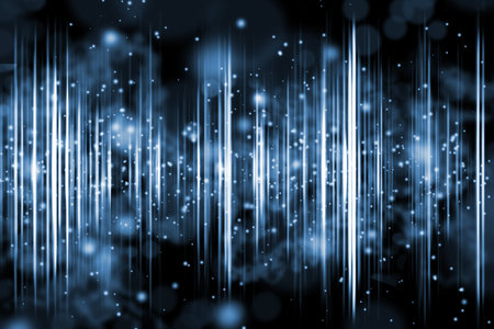 Abstract glitter bokeh on dark blue background.