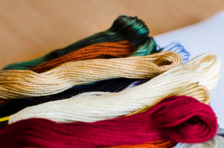 Bright multicolored embroidery thread yarns. Skeins of multicolored embroidery threads. Handmade...