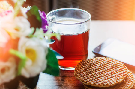 A wholesome, tasty breakfast of cereal biscuits and hot tea is served on the table.