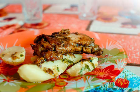 Fried chicken with boiled potatoes. Healthy wholesome food.の写真素材