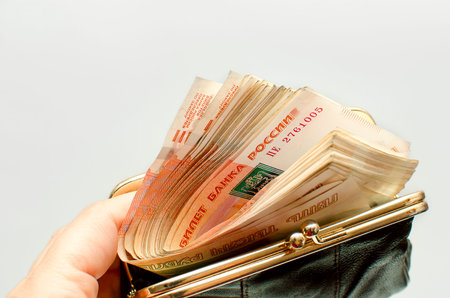 Russian rubles bills in open wallet. The denomination of the banknotes is five 5000 thousand rubles.