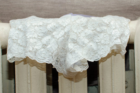 Lingerie is dried on a hot cast-iron battery in winter.