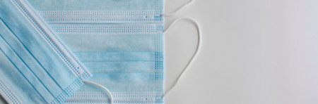 Medical protective masks on a white background. Close-up, panoramic background.