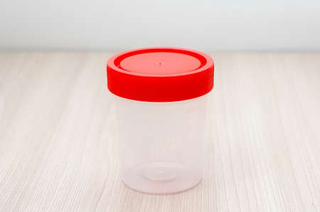 Plastic sterile container for collecting urine. Close-up, soft focus.の写真素材