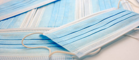Medical masks on a white background, close-up. Medical health protection. The pandemic. Hygiene...