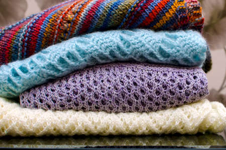 Folded clothes in openwork knitting. Self-knitted clothes.の写真素材