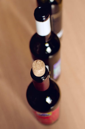Line of wine bottles. Close up, vertical photography.の写真素材