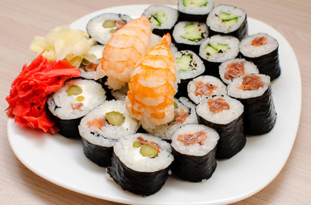 Mix of sushi and rolls, close-up. Japanese traditional food raw fish dishesの写真素材