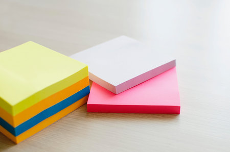 stack of multi-colored stickers on the table. place for text, copyspace.