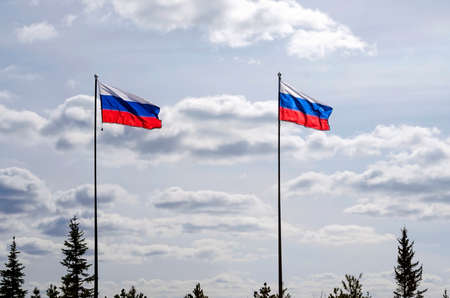Two Russian flags against the blue sky. Place for text, copyspace.の写真素材