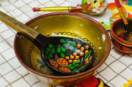 Russian wooden spoon in a bowl, close-up. Russian culture.の写真素材