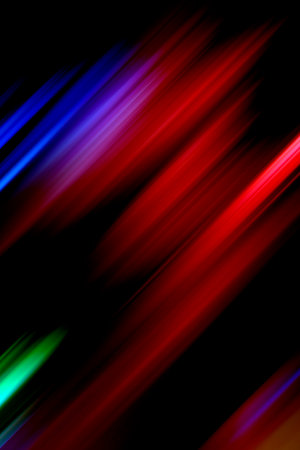 Diagonal red and blue blurred stripes on a black background. Abstract vertical background.の写真素材